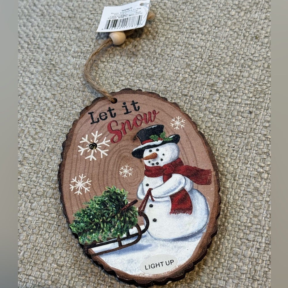 NEW. Ganz Festive Wooden Snowman Holiday Ornament that lights up.